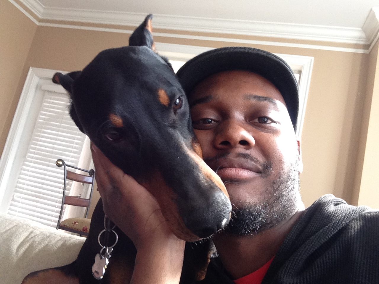 maurice belle pet sitter atlanta with doberman dog